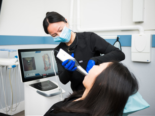 digital impressions being taken on patient using a scanner